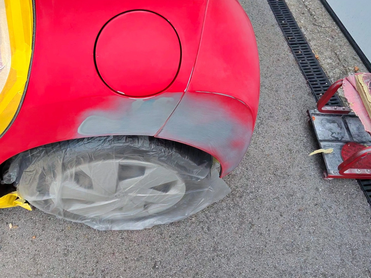 red-car-rear-quarter-panel-paint-repair-preparation